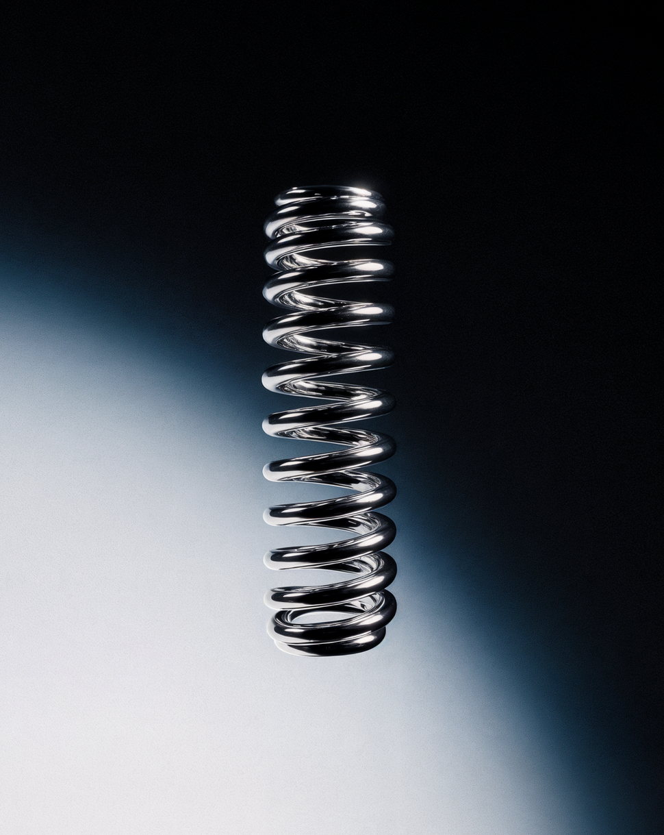 Shiny metal spring on a dark gradient background, symbolizing brand strategy as a source of resilience and flexibility during market contractions.