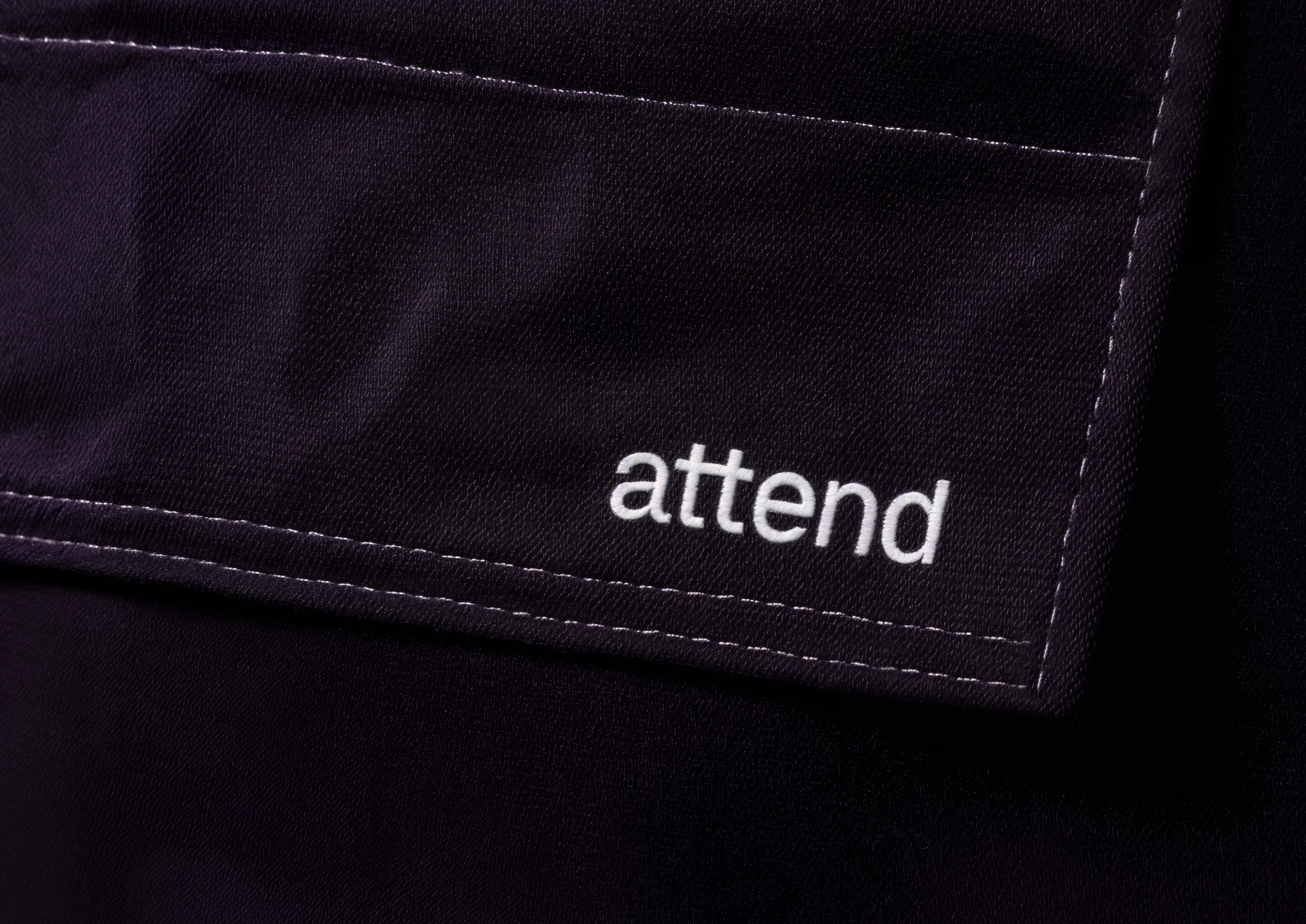 Embroidered Attend logotype.